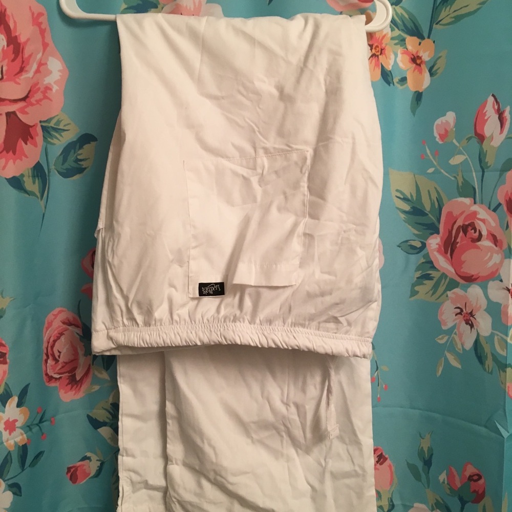 Lydia’s white scrub pants